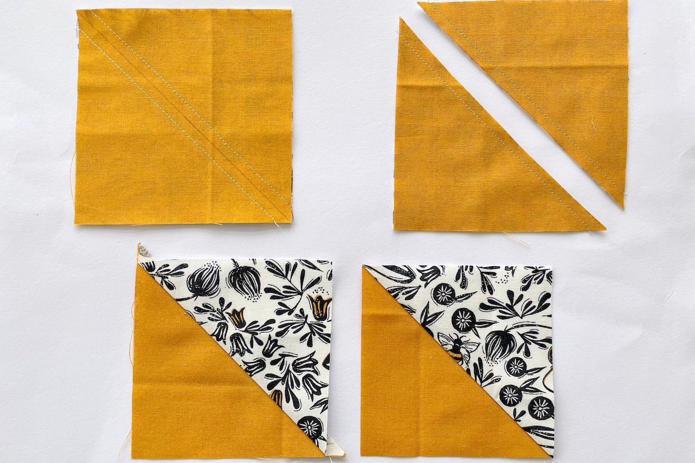 triangles de tissu demi-carré vert blanc et jaune sur table blanche
